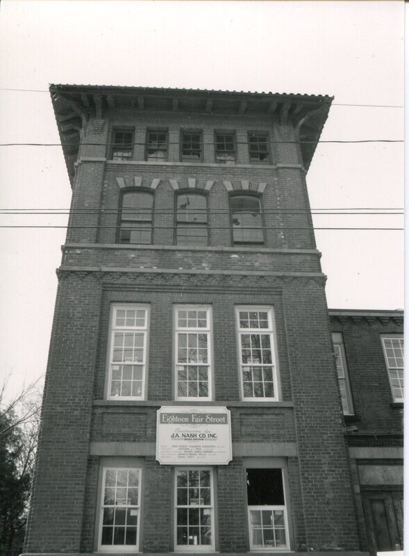 Tower With New Windows and J.A. Nash Co. Inc. Sign