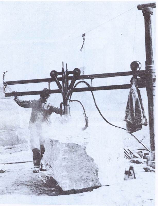A worker cutting stone at the Beattie Quarry Co., Leete's Island