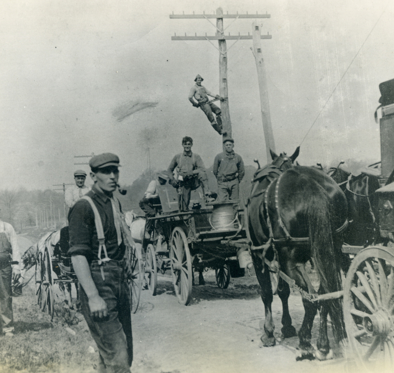 Workers installing telephone wires, 1911.