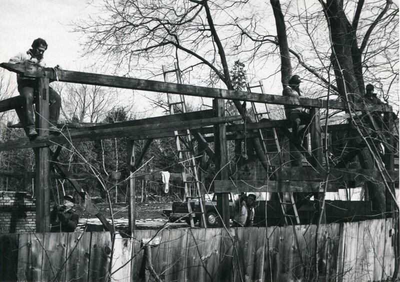 Construction Workers on Wooden Frame