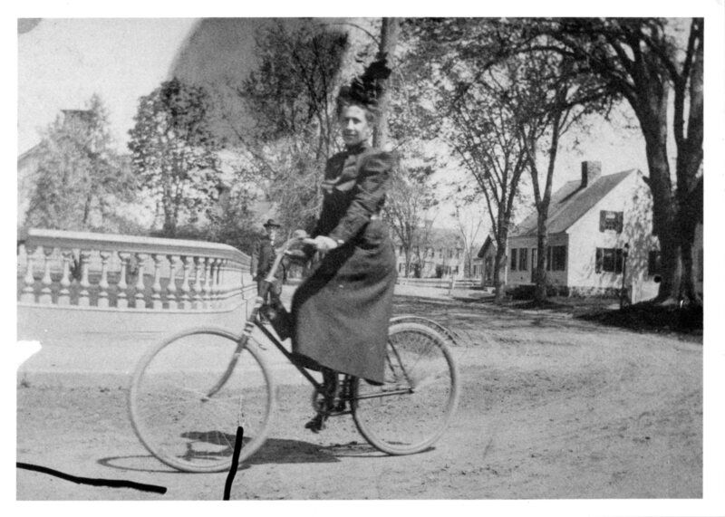 Marilla Bishop Spencer riding her bicycle, circa 1900