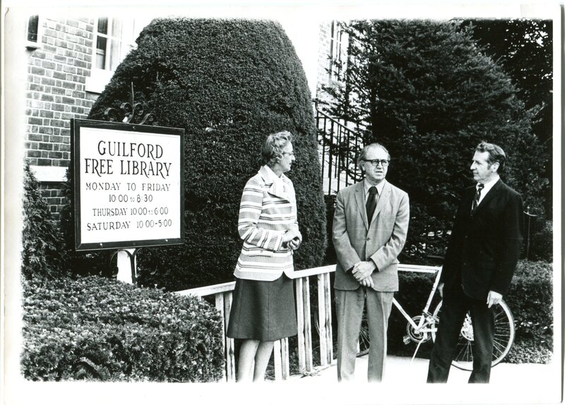 Library Director Edith B. Nettleton stands outside the library with building committee members in 1974