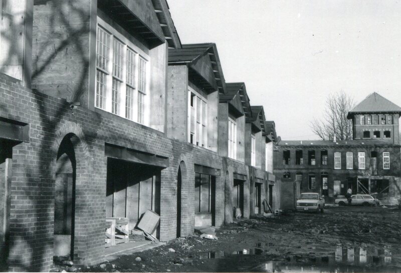 Mid-Construction Garages and Entryways of Townhouses, Foundry Building Behind