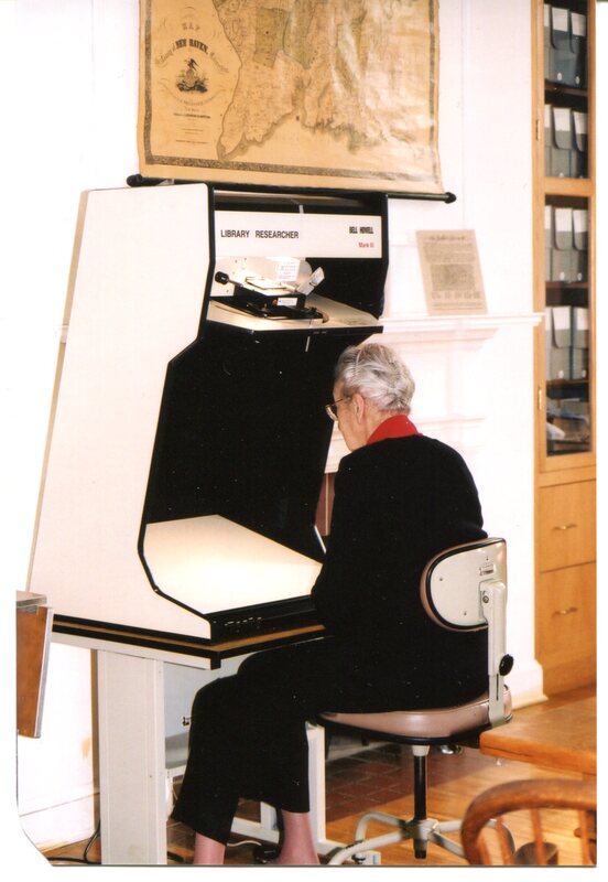 Edith B. Nettleton works with microfilm in the Guilford Free Library's Historical Room