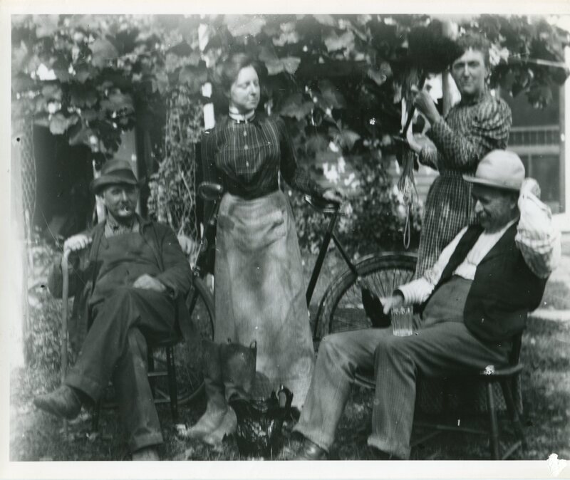 Men and women by bicycle